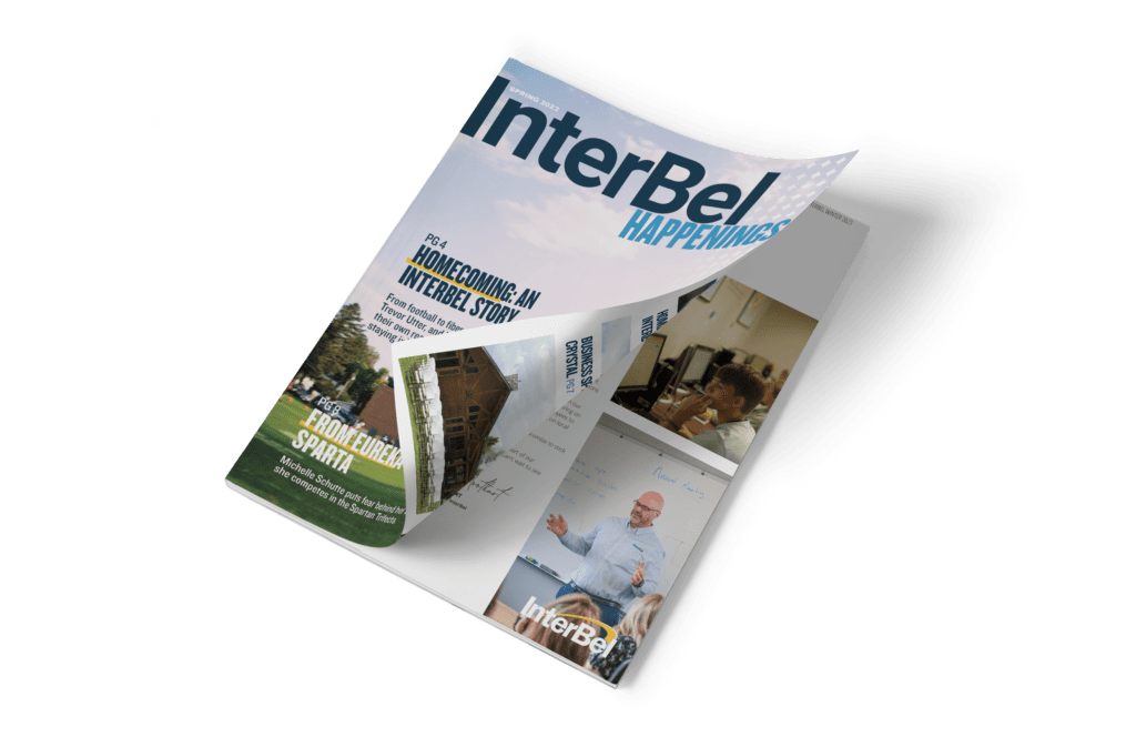 Magazine mockup featuring InterBel Happenings.